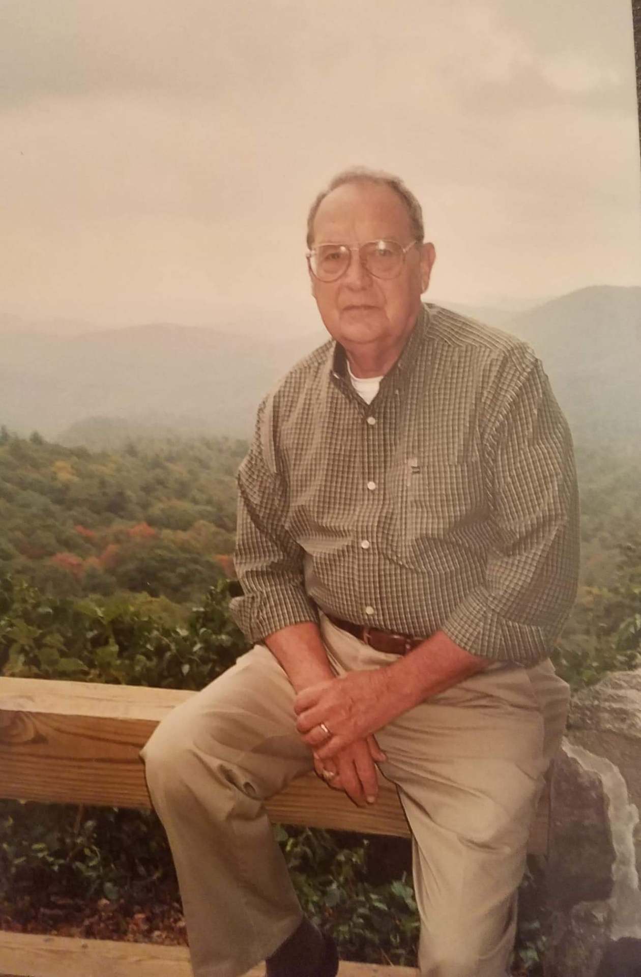 Hugh Gwynn, founder of North Georgia Beverage, seated at a mountain overlook